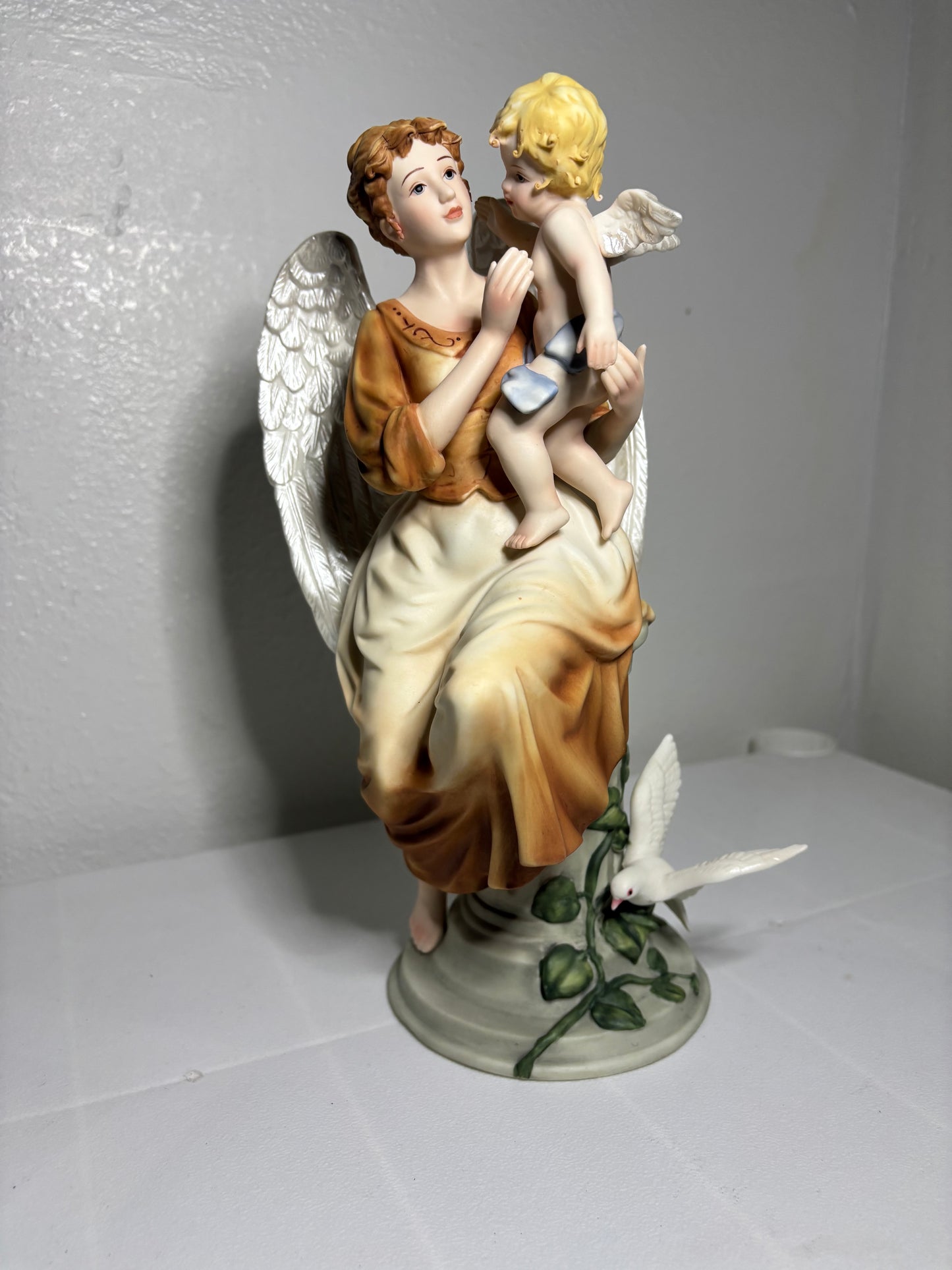 Vintage Porcelain Angel Figurine Holding Child – Hand-Painted Collectible