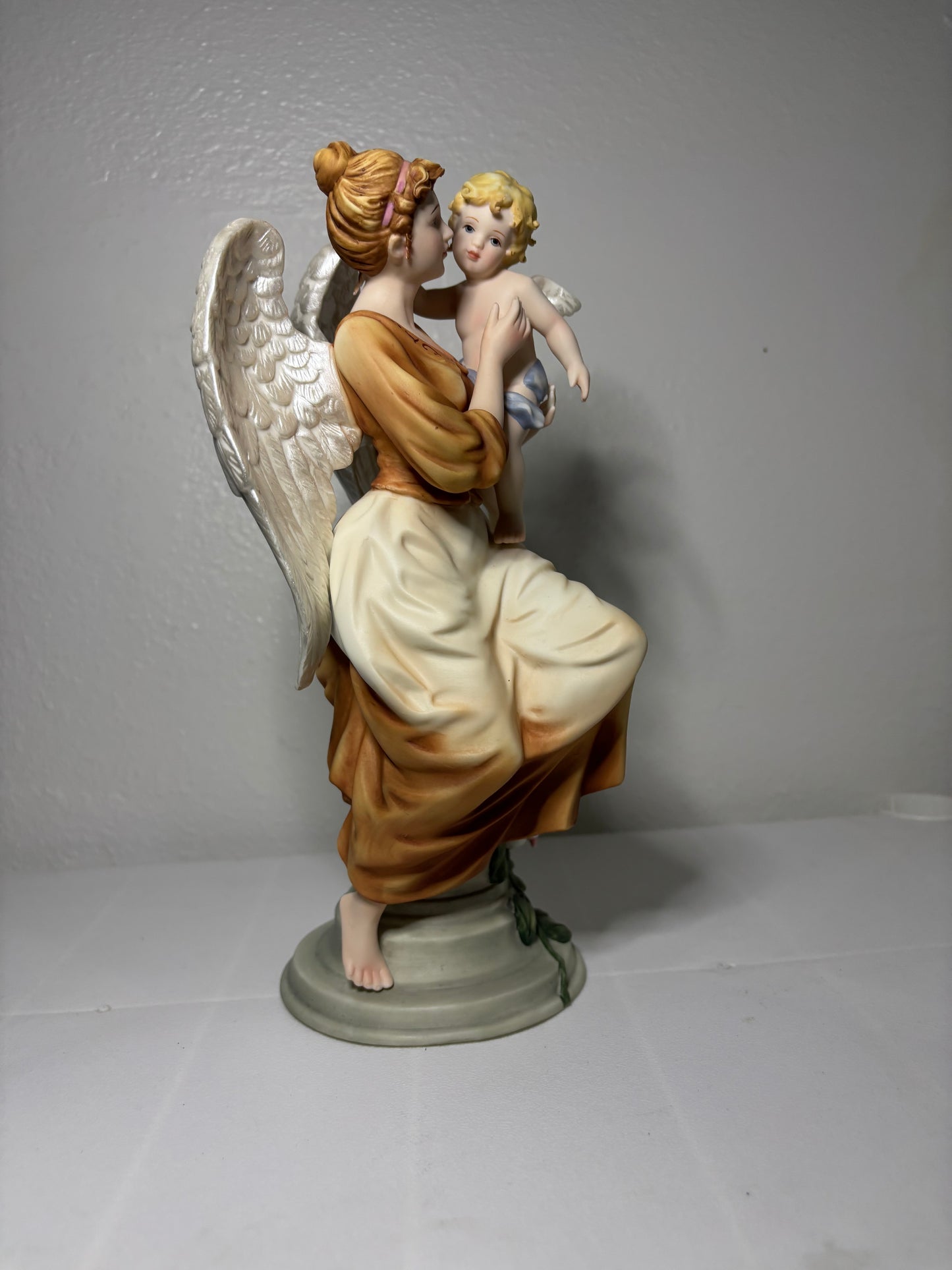 Vintage Porcelain Angel Figurine Holding Child – Hand-Painted Collectible