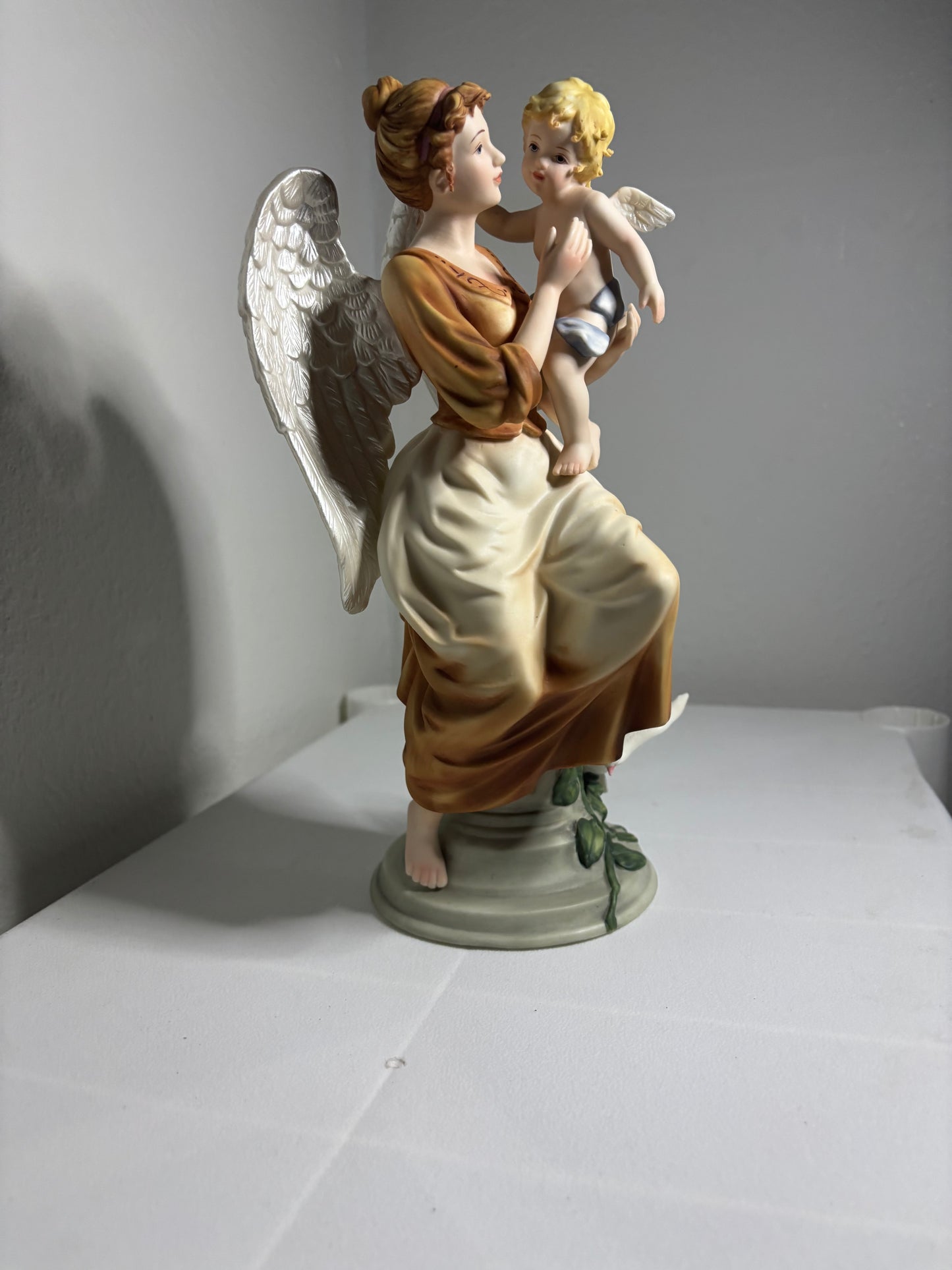 Vintage Porcelain Angel Figurine Holding Child – Hand-Painted Collectible
