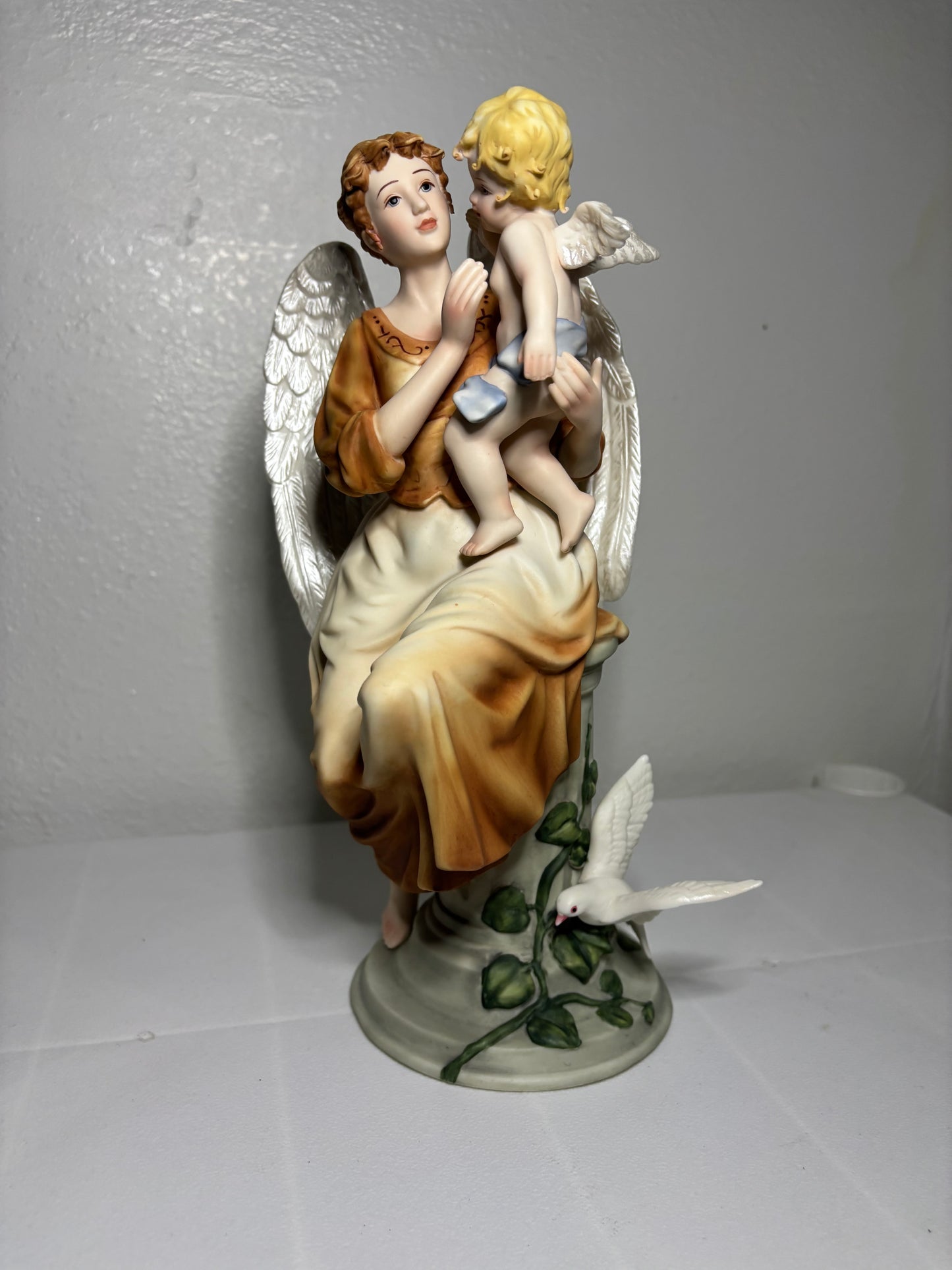 Vintage Porcelain Angel Figurine Holding Child – Hand-Painted Collectible