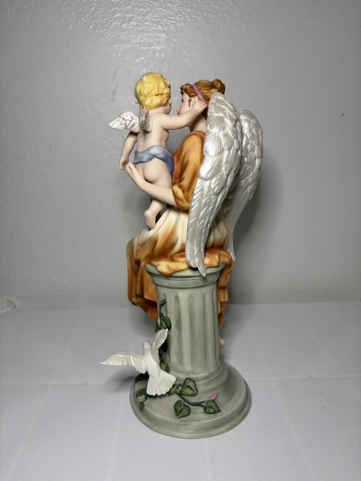 Vintage Porcelain Angel Figurine Holding Child – Hand-Painted Collectible